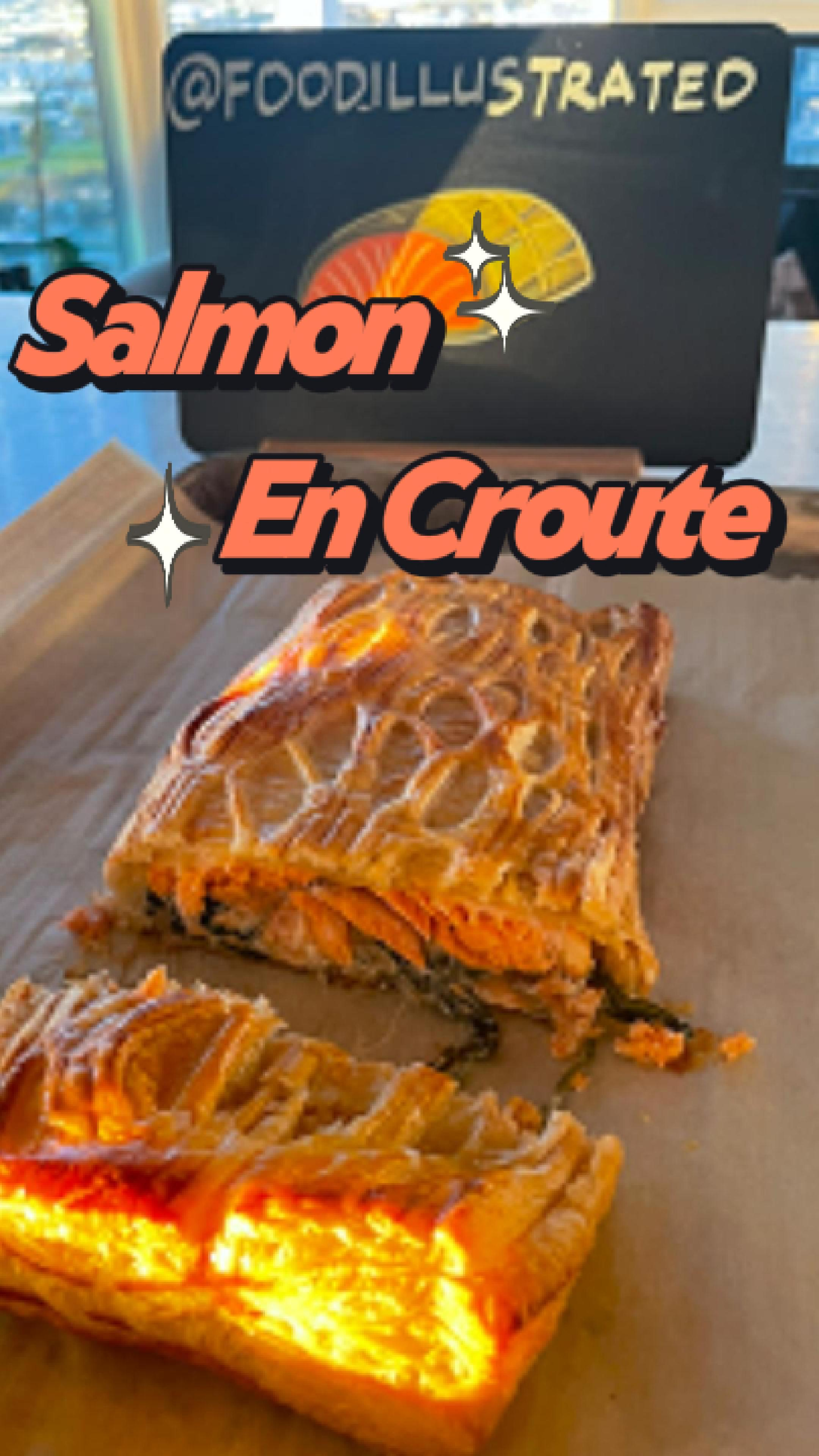Golden brown Ultimate Salmon en Croute sliced to reveal layers of flaky puff pastry, creamy spinach filling, and perfectly cooked salmon on a wooden board.