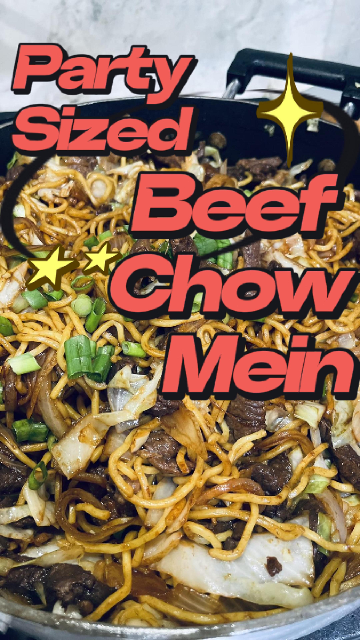 Giant wok of Beef Chow Mein with tender sliced beef, crispy cabbage, and savory noodles garnished with green onions and sesame seeds.