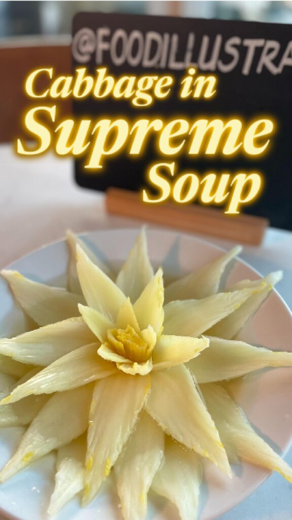 Chinese Consommé Kaishui Baicai served in a white bowl with a delicate cabbage heart submerged in crystal-clear amber-gold broth.