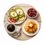 French toast with mixed berries and pancakes with coffee on a wooden table