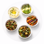 Five side dishes including roasted vegetables, mashed potatoes, rice pilaf, green beans, and dinner rolls