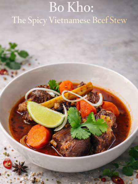 Steam rising from a bowl of Vietnamese Bo Kho beef stew with rice noodles, topped with fresh cilantro and Thai basil