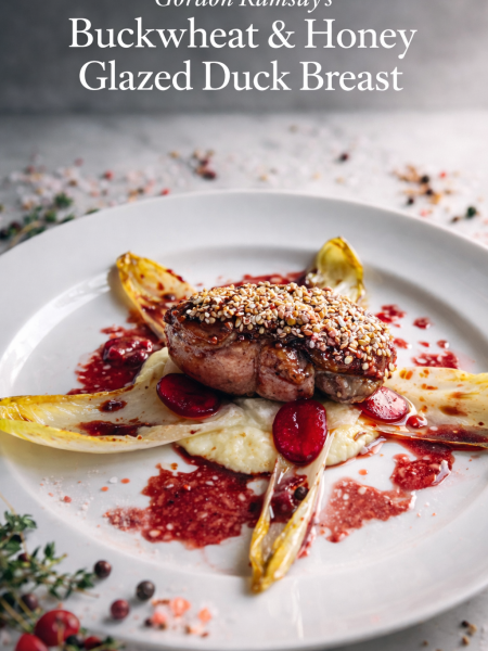 Perfectly cooked Gordon Ramsay-style duck breast with crispy scored skin and toasted buckwheat crust, sliced and fanned over silky parsnip purée, with sweet-and-sour endive, pickled daikon and cherries, and a glossy port wine glaze.