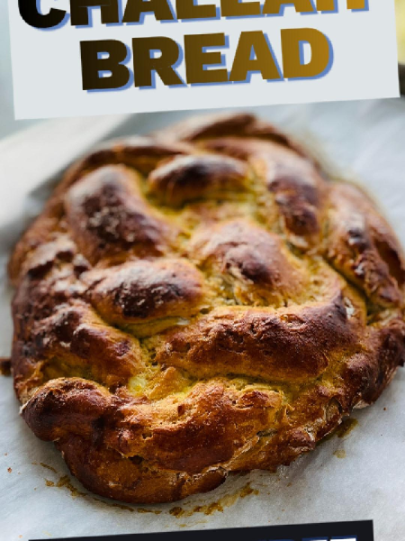 golden brown, perfectly braided gluten-free Challah bread loaves resting on a parchment-lined baking sheet, fresh from the oven with a glossy egg wash crust.