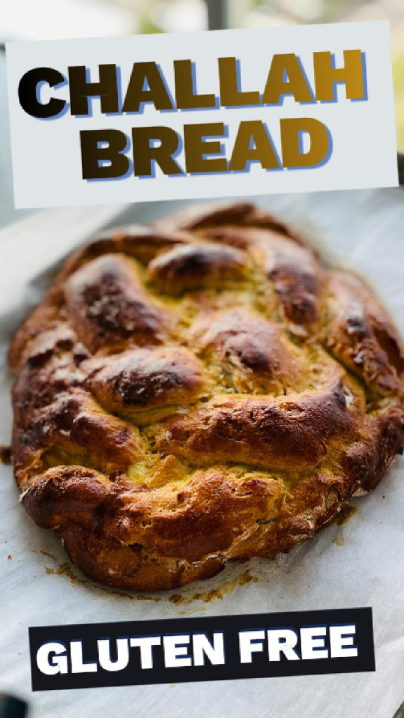 golden brown, perfectly braided gluten-free Challah bread loaves resting on a parchment-lined baking sheet, fresh from the oven with a glossy egg wash crust.