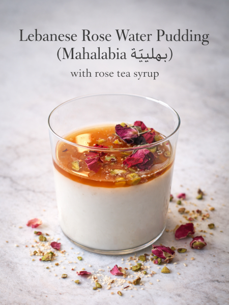 Lebanese rose water pudding in glass with rose syrup drizzle and dried rose petal garnish