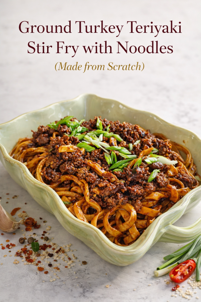 A sharing bowl filled with Ground Turkey Teriyaki Stir Fry with Noodles, garnished with fresh green onions.