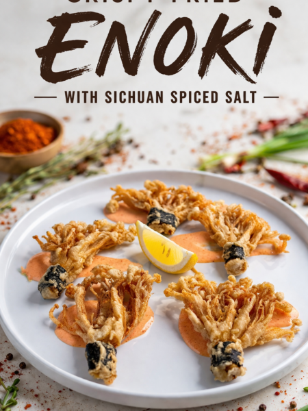 Crispy fried enoki bundles wrapped in nori, dusted with Sichuan spiced salt, served on a wire rack with lemon wedges and spicy mayo dip.